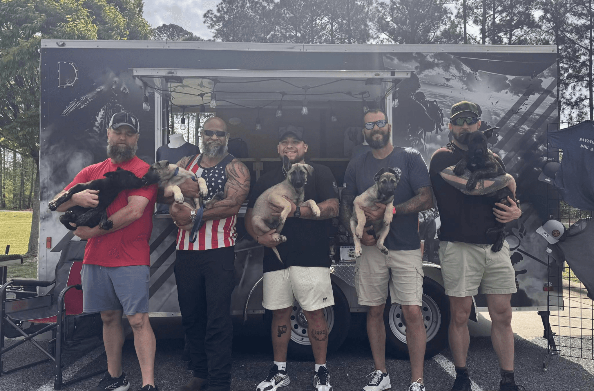 JTFK9s introducing Belgian Malinois puppies to their new owners